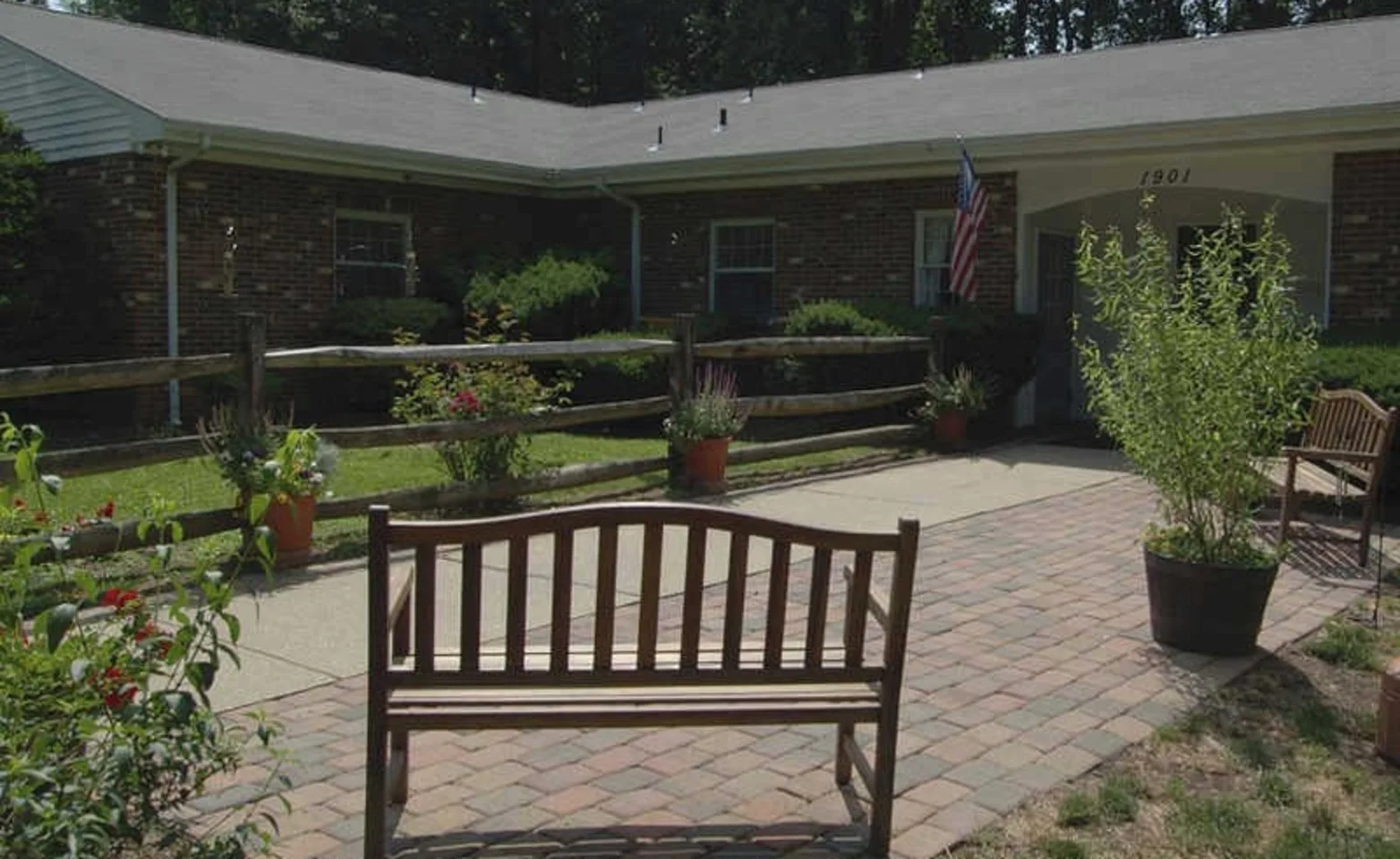 Front of the building with a bench 